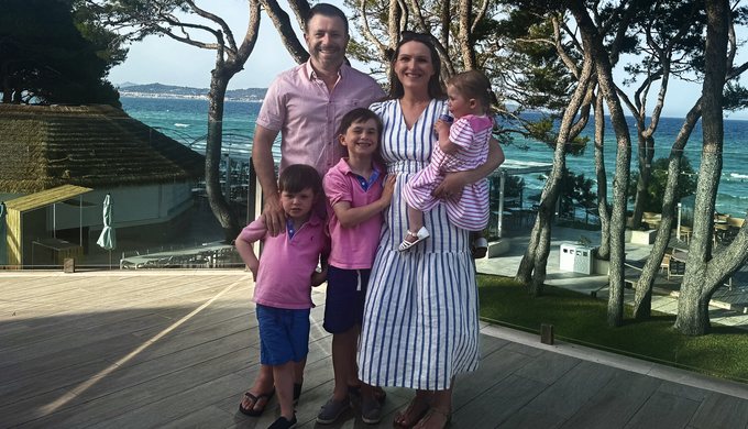 James with his wife and three children on holiday