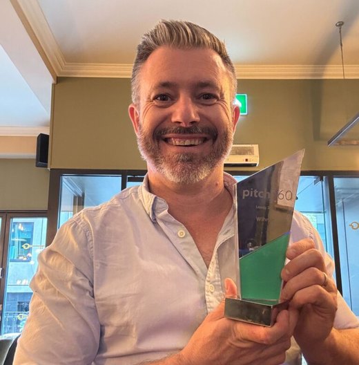 James O'Sullivan holding the Pitch60 winner's trophy